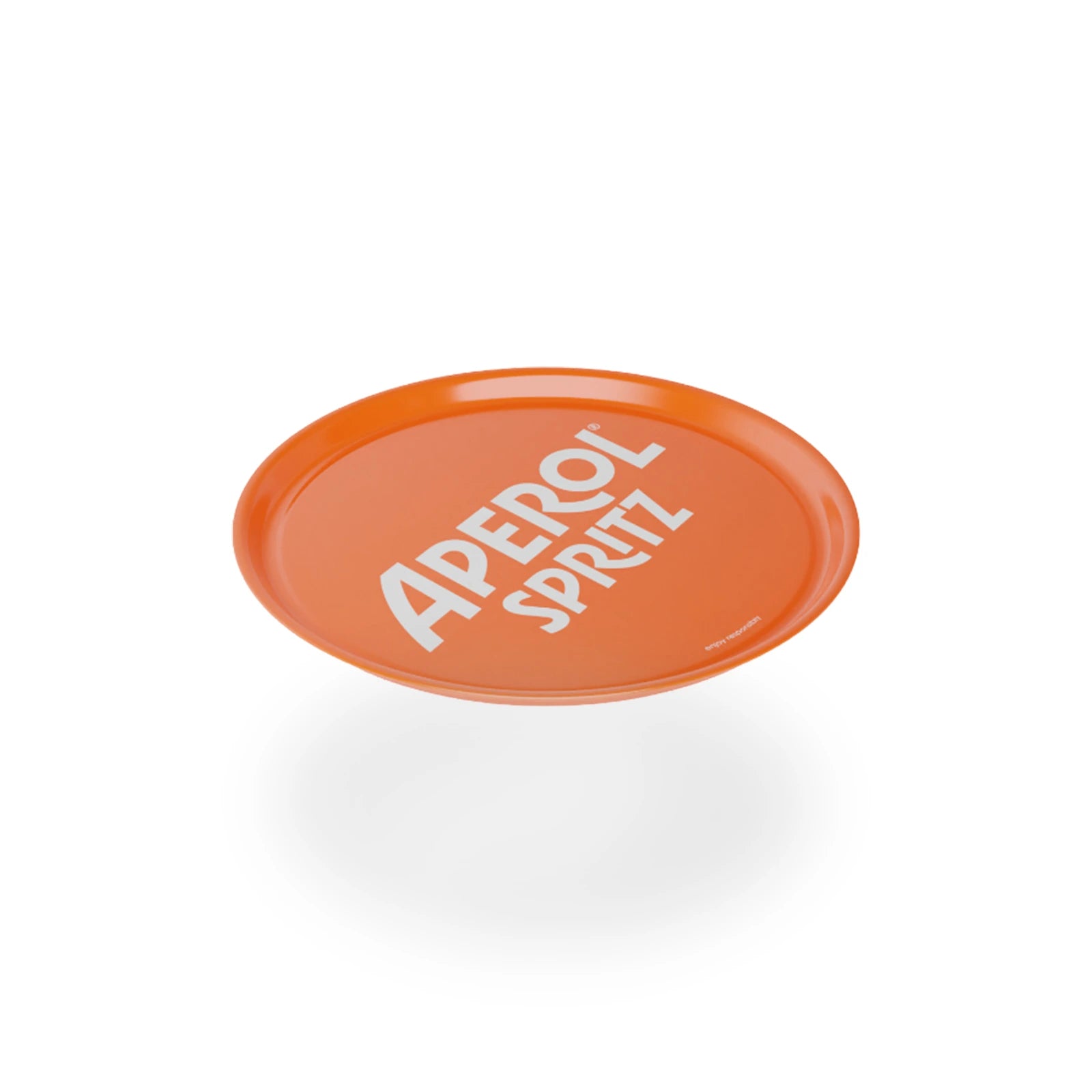 Angled view of a bright orange Aperol Spritz round bar tray with bold white branding across the center, floating above a white surface with a soft shadow beneath.